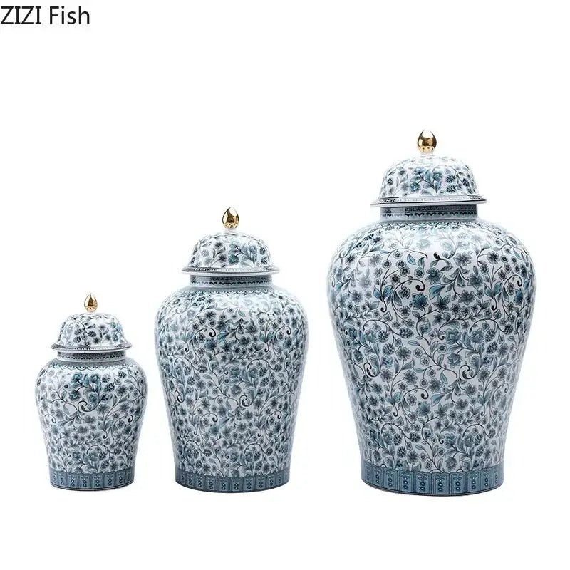Set of three elegant blue white ceramic ginger jars with intricate floral patterns and gold-tipped lids for living room decorbites