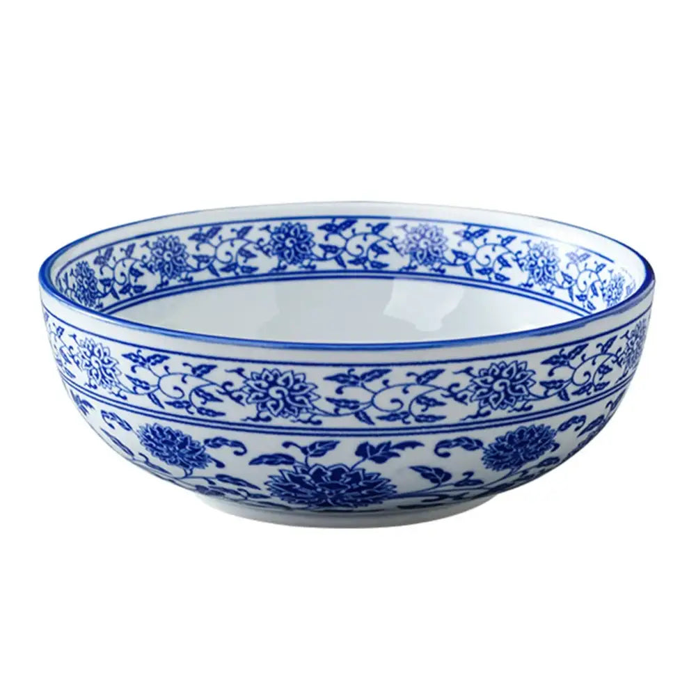 A white ceramic soup bowl with intricate blue floral and vine patterns from decorbites blue for dining use