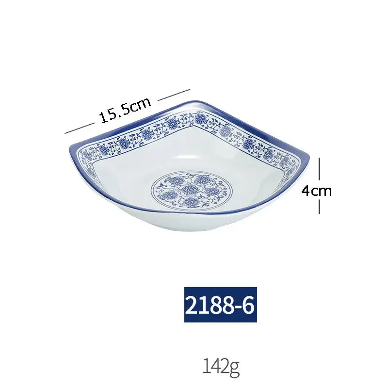 A white imitation porcelain dish with blue floral patterns measuring 15.5cm wide from a floral blue and white dinner set