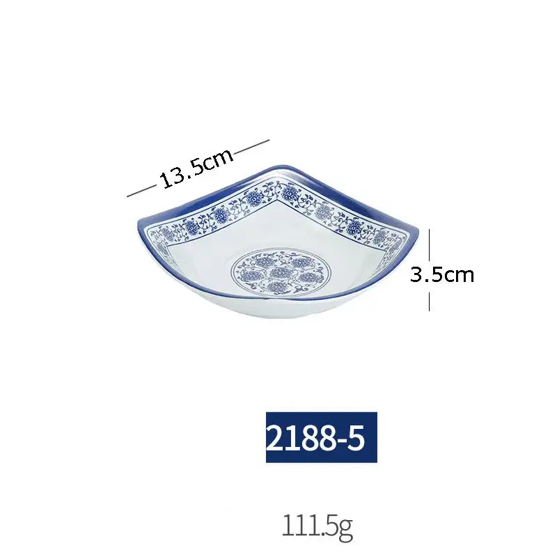 White imitation porcelain dish with blue floral patterns and scalloped edge from floral blue and white dinner set