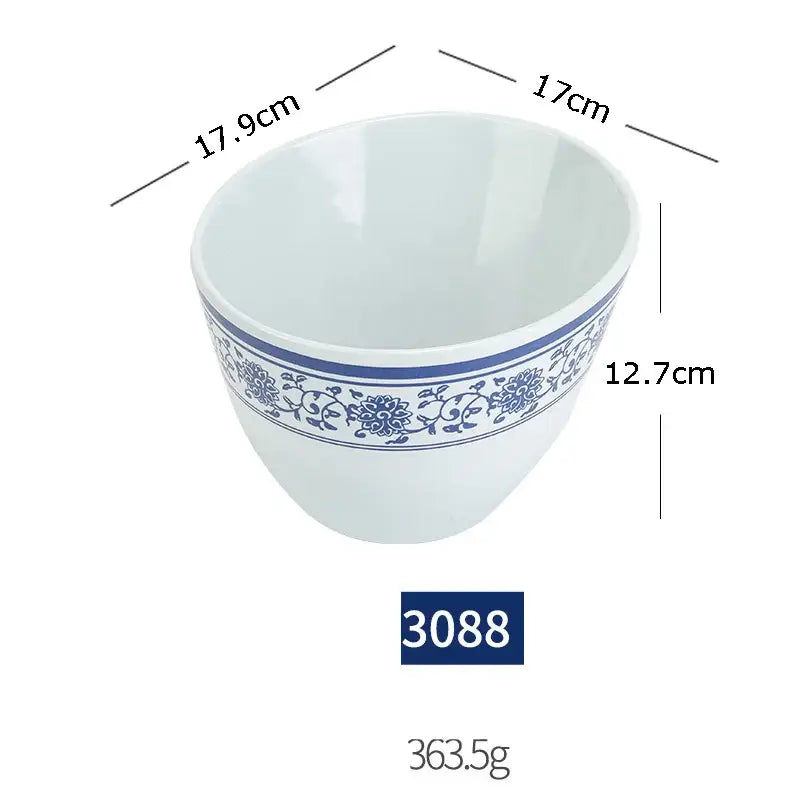 White ceramic bowl with blue floral pattern rim from floral blue and white imitation porcelain dinner set