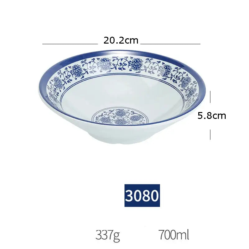 A white imitation porcelain dinner set bowl with intricate blue floral patterns and a glossy finish for dining room use