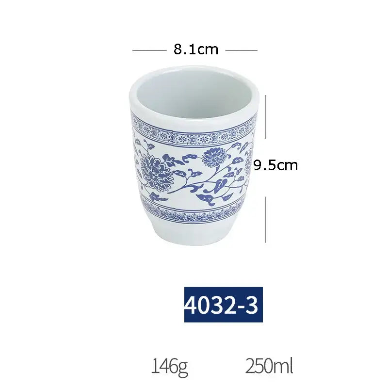 A white imitation porcelain planter with blue floral vine patterns from a floral blue and white imitation porcelain dinner set