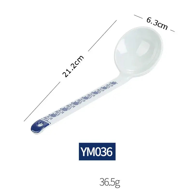 A white imitation porcelain ladle with blue floral pattern and dark blue accent from a floral blue and white dinner set