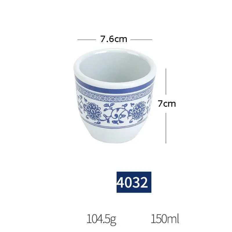 White ceramic planter with blue floral and vine patterns in a floral blue and white imitation porcelain dinner set