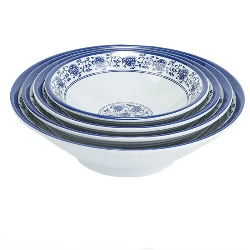 Set of five nested ceramic bowls with blue floral patterns in a white imitation porcelain dinner set