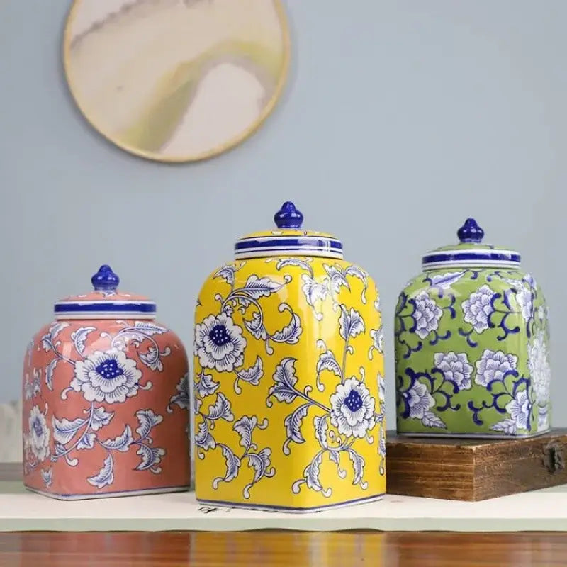 Three ceramic jars with pink yellow and green floral patterns and blue white porcelain lids for living room decorbites blue white porcelain