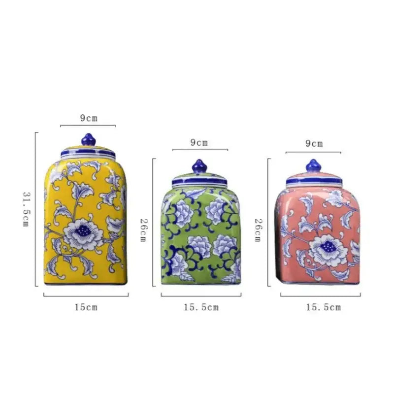 Three ceramic blue white porcelain general jars with yellow, green, and pink bodies featuring floral decorbites blue white patterns