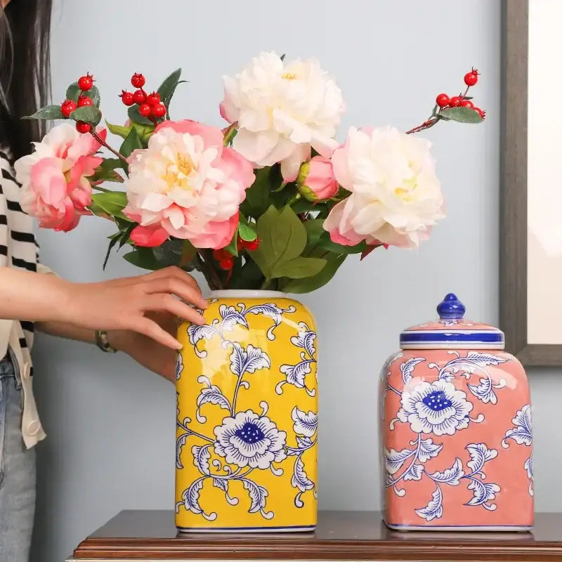 Yellow ceramic vase with blue floral patterns holding pink and white peonies blue white porcelain decorbites living room decor