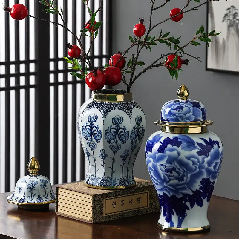 Floral blue and white porcelain general jar vase with gold-trimmed lids and intricate floral patterns for living room decor