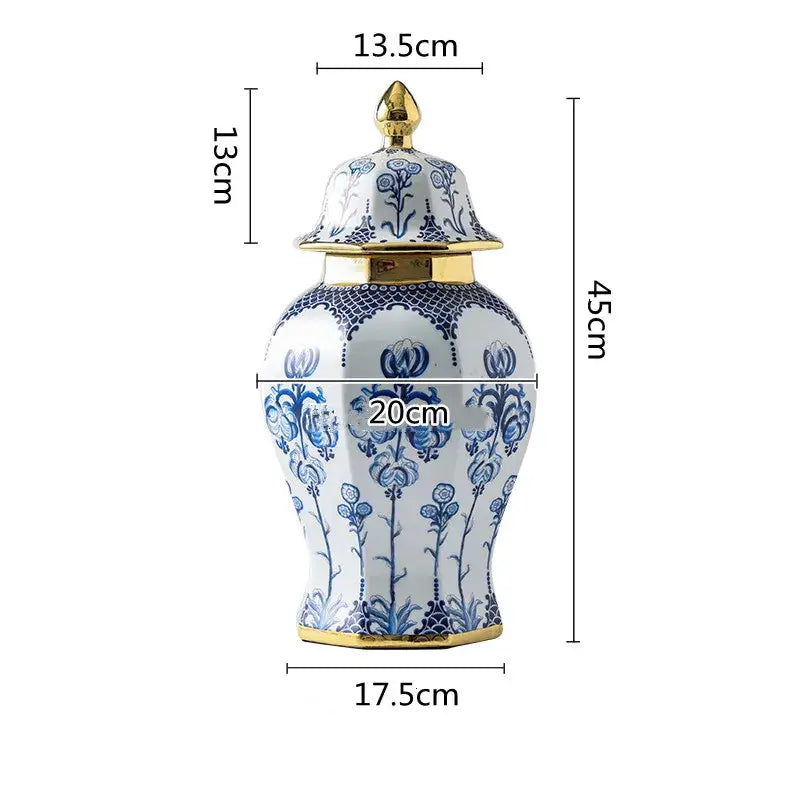 Floral blue and white porcelain general jar vase with gold-trimmed lid and base featuring intricate floral patterns
