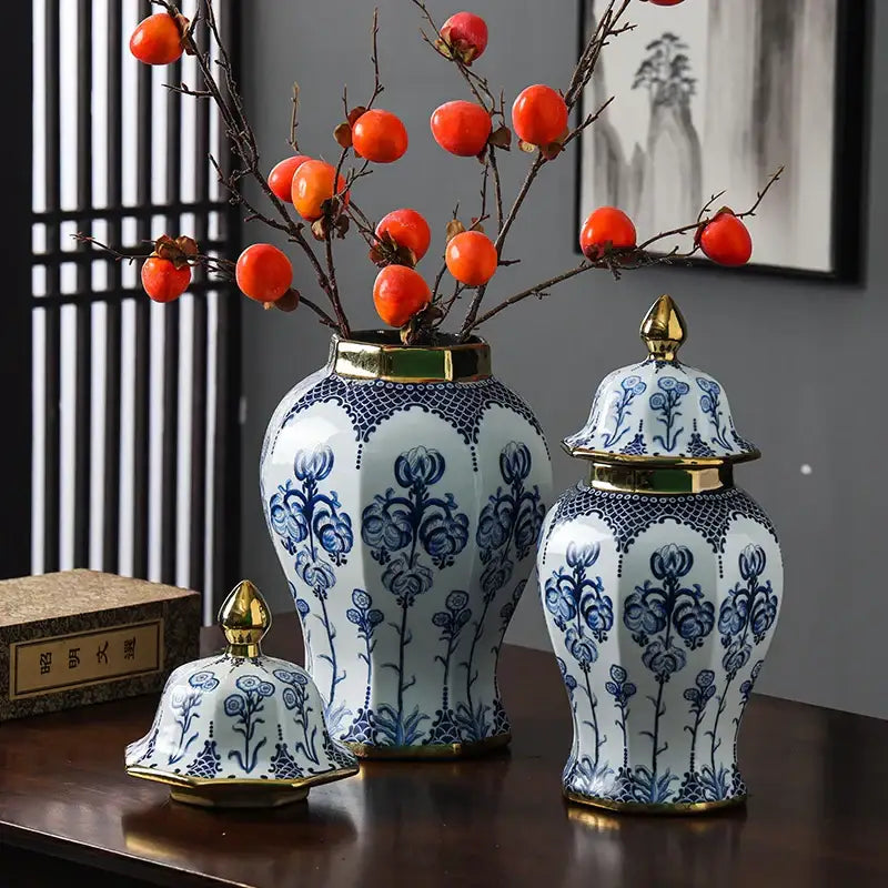 Floral blue and white porcelain general jar vase with gold-trimmed lid and base featuring intricate floral patterns