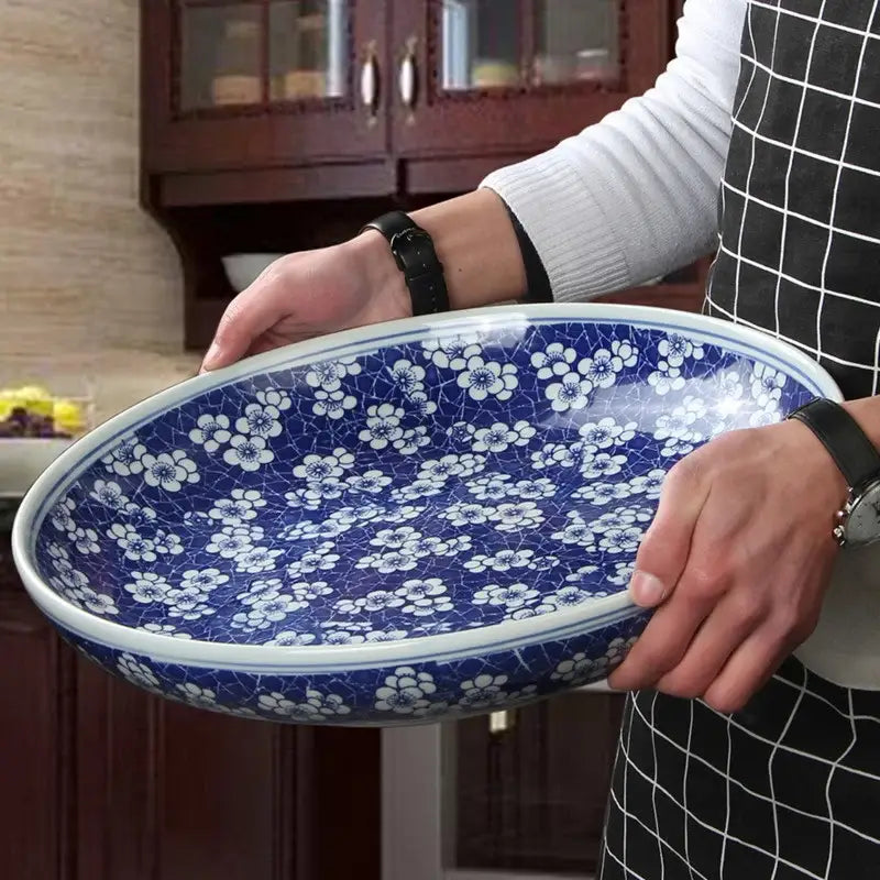 Blue and white porcelain serving plate with delicate floral patterns ideal as a white porcelain serving dish
