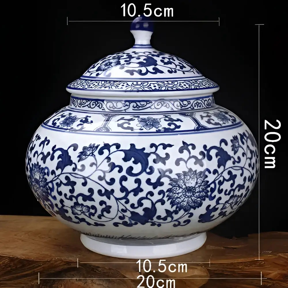 A classic blue white porcelain storage tank with intricate floral patterns and matching lid for living room decorbites jar