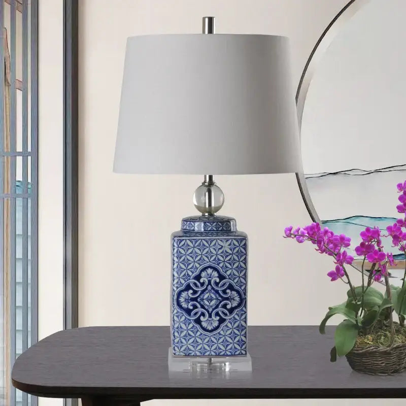Blue and white ceramic table lamp with intricate floral patterns in white porcelain decorbites blue white style