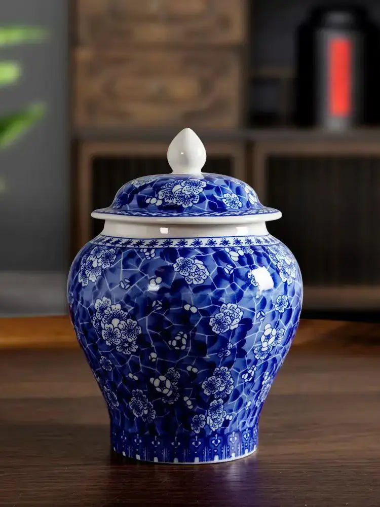 Floral blue and white porcelain tea canister with a matching lid and finial for kitchen storage by decorbites blue white
