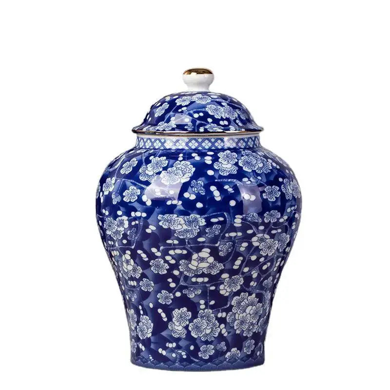 Floral blue and white porcelain tea pot storage container with intricate floral patterns and gold-trimmed lid