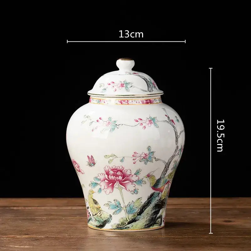 White porcelain tea pot storage container with matching lid featuring delicate pink and green floral peonies and birds
