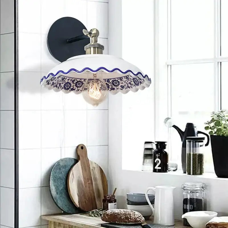 White ceramic wall lamp with blue white porcelain floral pattern and scalloped edge by decorbites for living room decor