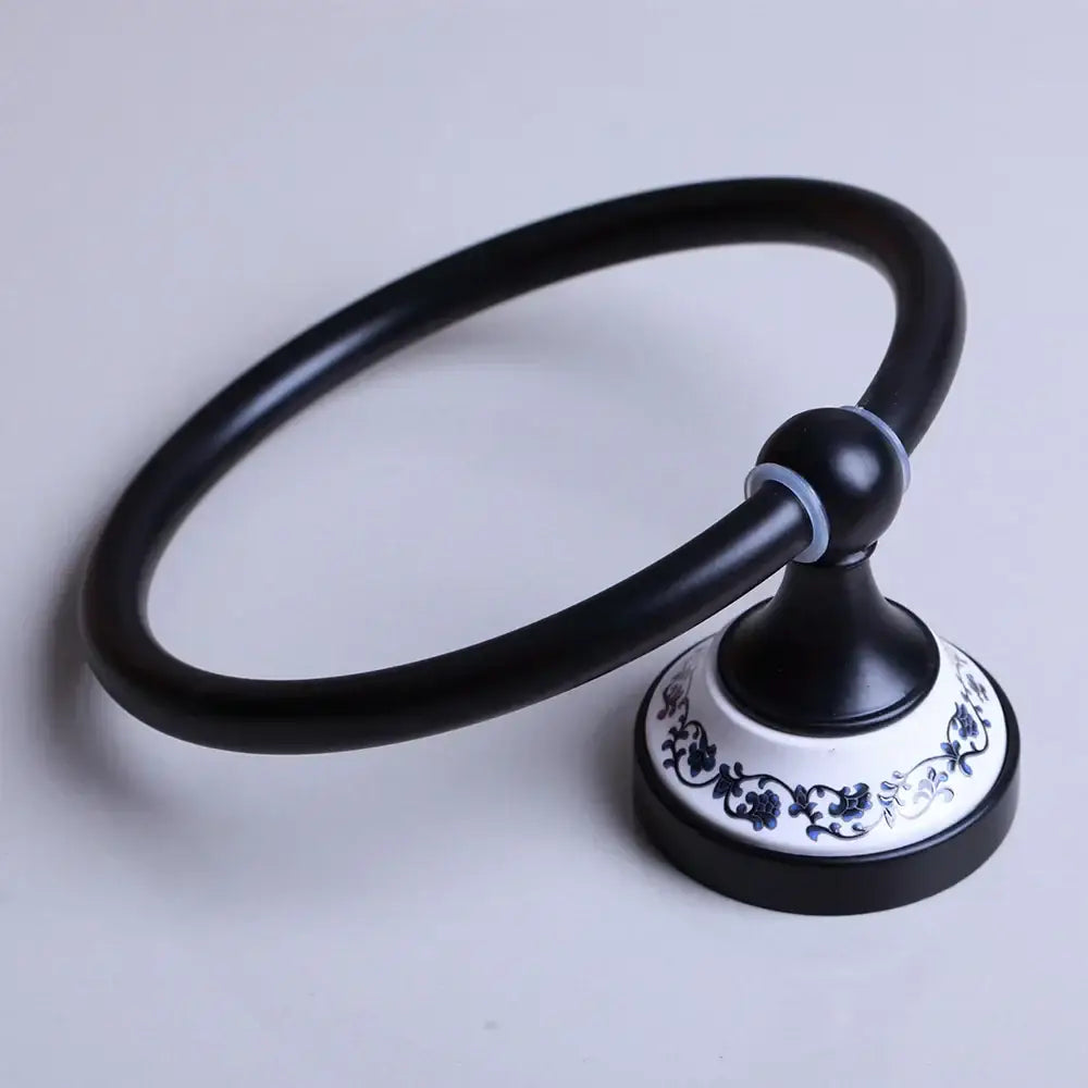Black matte towel ring with decorative white ceramic base featuring blue floral patterns for bathroom decorbites black stainless steel decor
