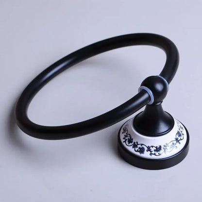Black matte towel ring with decorative white ceramic base featuring blue floral patterns for bathroom decorbites black stainless steel decor