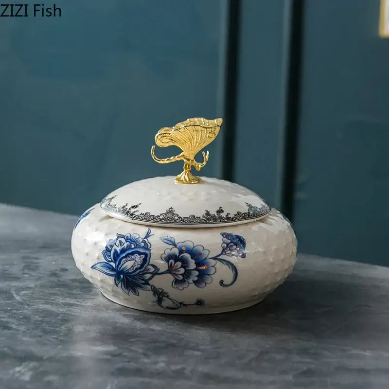 Floral ceramic jewelry box with white and blue patterns and a gold decorbites dragonfly lid for bedroom storage
