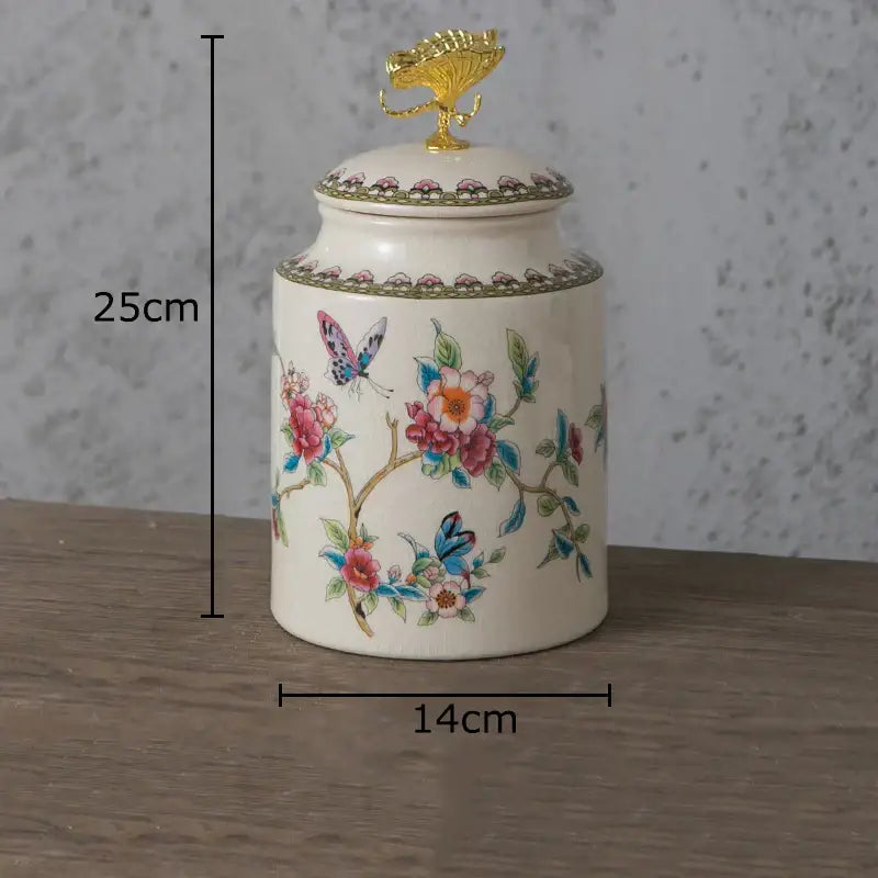 Cream-colored ceramic storage jar with delicate floral motifs and gold decorbites dragonfly lid for bedroom decor