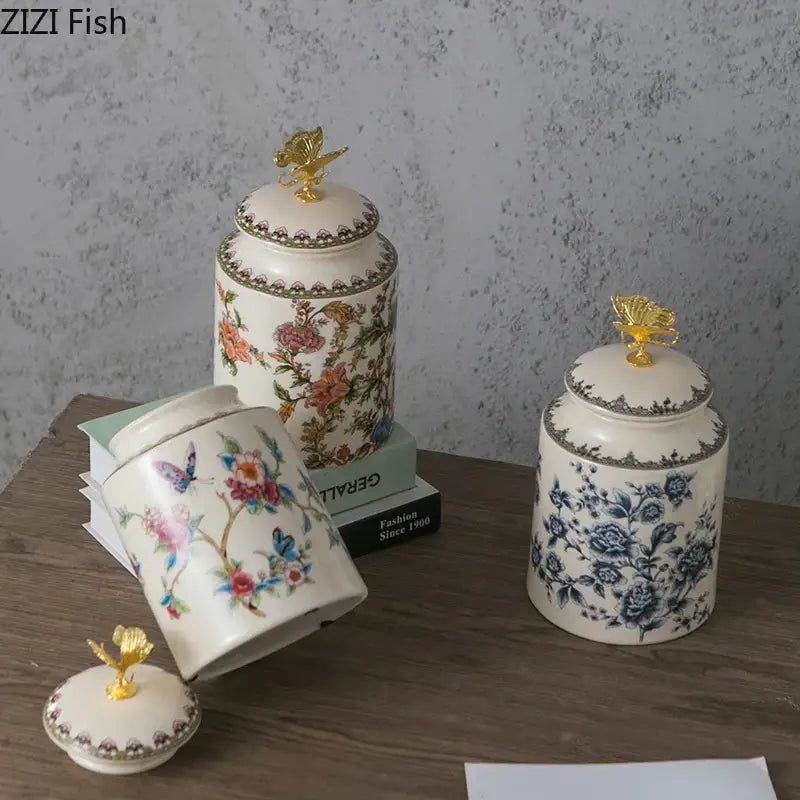 White ceramic floral storage jar with intricate butterfly design and gold decorbites dragonfly lid for jewelry storage