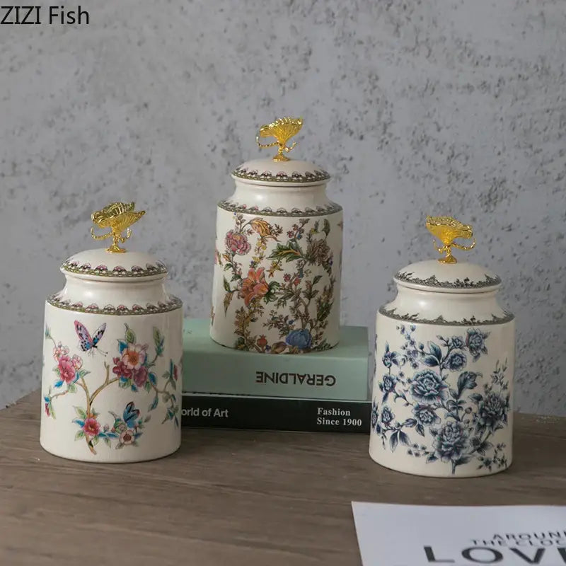 Three ornate floral ceramic storage jars with gold lion-head and decorbites dragonfly lids for bedroom jewelry storage