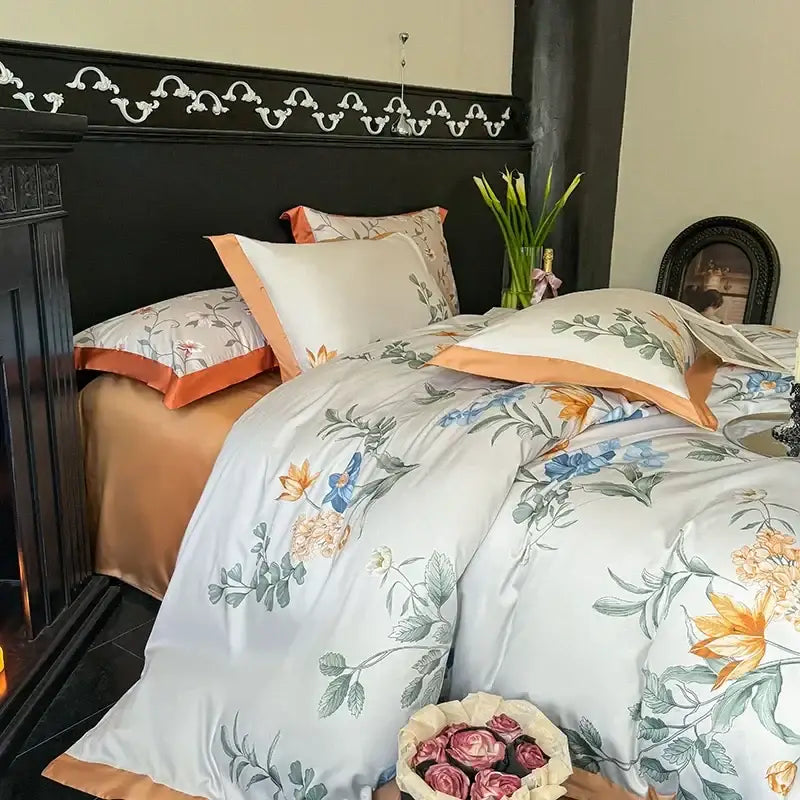Elegant white satin duvet cover with delicate floral pattern and peach piping in a floral cream and caramel egyptian cotton bedding set