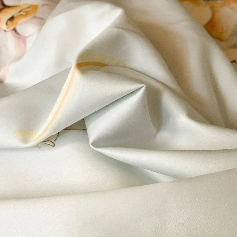 Floral cream and caramel egyptian cotton bedding set featuring off-white satin fabric with muted peach floral pattern