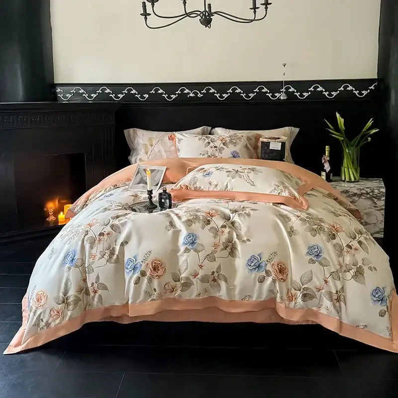 Cream-colored satin duvet cover with blue and peach floral embroidery and peach border in egyptian cotton bedding set