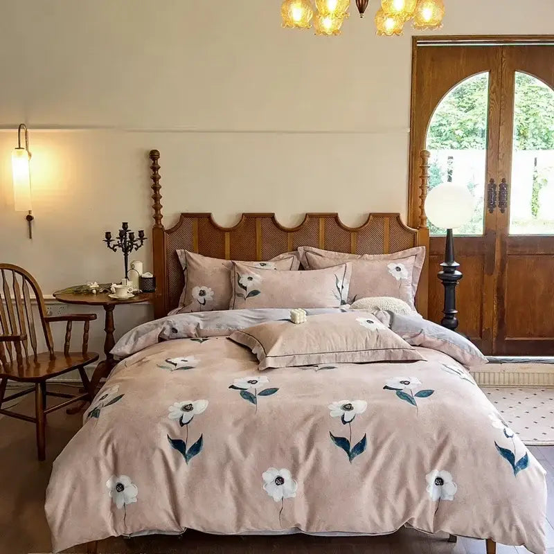 A soft blush pink velvet duvet set with white and teal floral embroidery in egyptian cotton bedding sets
