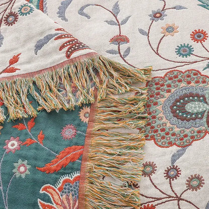 Floral cream jacquard cotton gauze sofa cover with hand-embroidered teal coral blue floral pattern and multicolored fringe