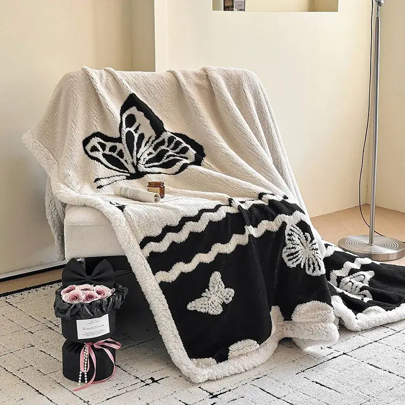 Cream and black jacquard lamb wool blanket with textured butterfly design soft plush living room throw