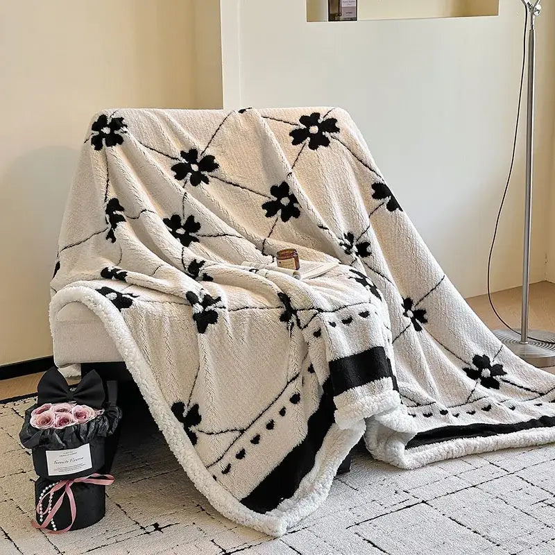 Cream-colored jacquard lamb wool blanket with black floral and heart patterns soft textured living room throw