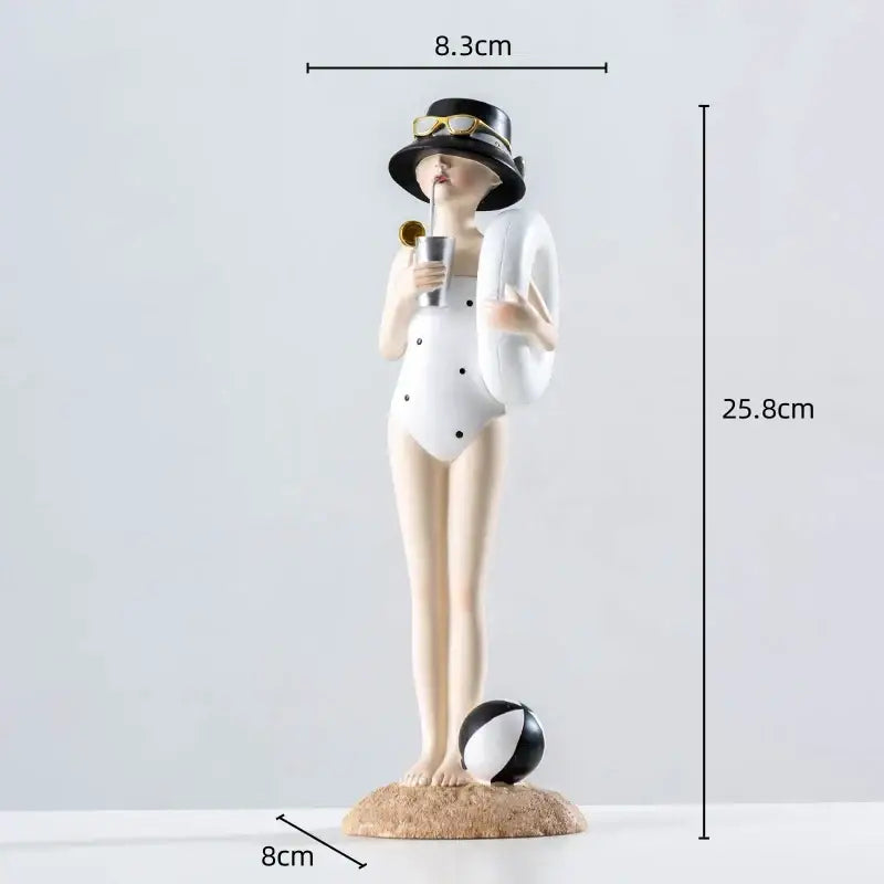 A stylish white polka-dot resin figure sculpture with black hat gold sunglasses holding metallic cup and inflatable ring
