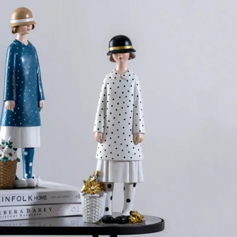 White polka-dot coat dress resin figure sculpture with black hat and gold trim for living room decor