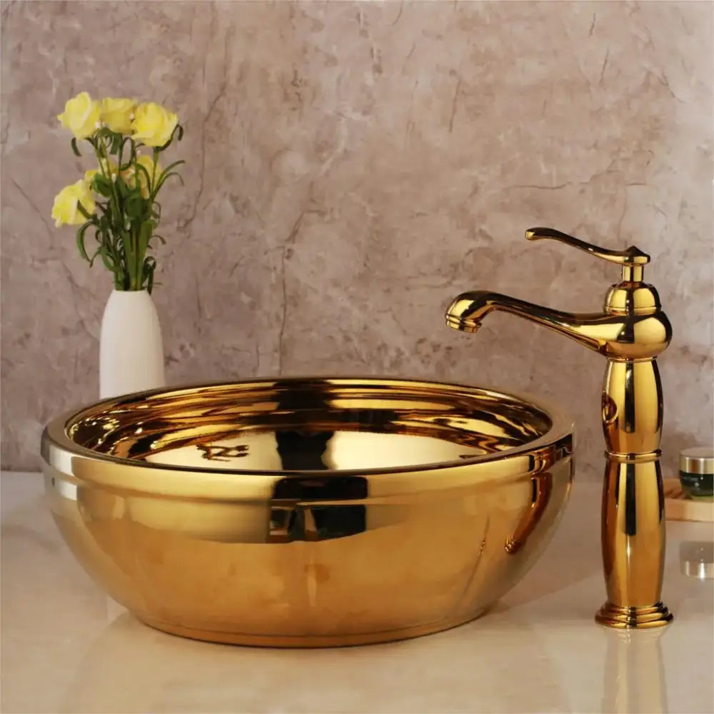 Golden glossy floral embossed ceramic washbasin with matching brass mixer faucet bathroom set by decorbites golden ceramic