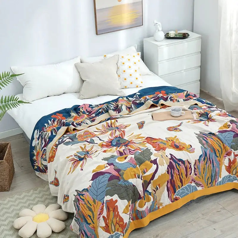 Floral embroidered cream and navy cozy gauze cotton throw with vibrant multicolored flower patterns for decorbites cozy gauze