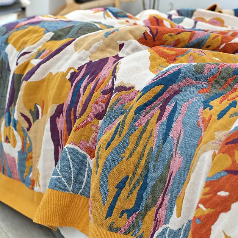 Floral embroidered cream and navy cozy gauze cotton throw with vibrant multicolored floral-patterned bedspread decorbites cozy gauze