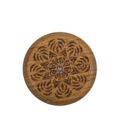 Circular wooden french bread lame with intricate floral carving and central metallic fastener for bread lame dough scoring decorbites french bread