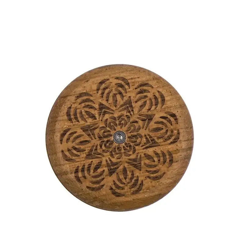 Circular wooden french bread lame with intricate floral carving and central metallic fastener for bread lame dough scoring decorbites french bread