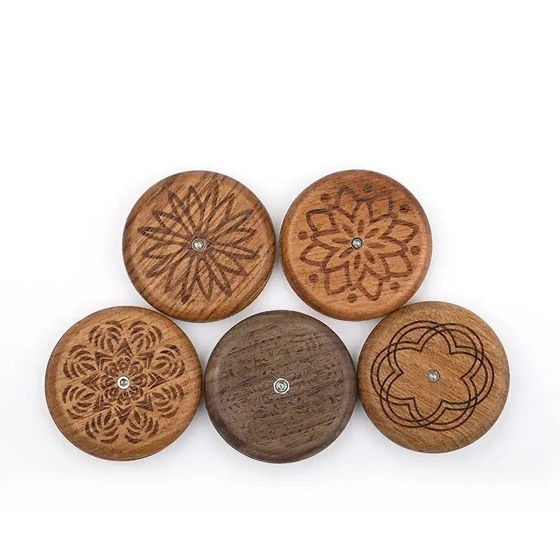 Five round wooden buttons with intricate floral and geometric engravings and metallic centers for decorbites french bread lame