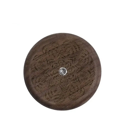 Dark brown wooden circular french bread lame with intricate floral engraving and central metallic screw for bread lame dough scoring decorbites french bread