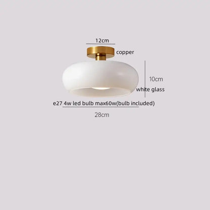 A modern glass led ceiling lamp with a floral etched white shade and polished copper base for living room use