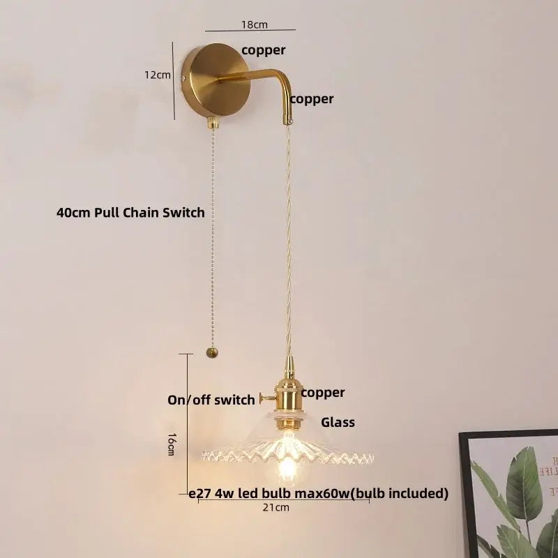 Brass-finished copper led wall sconce with floral glass shade and pull chain switch for bathroom lighting