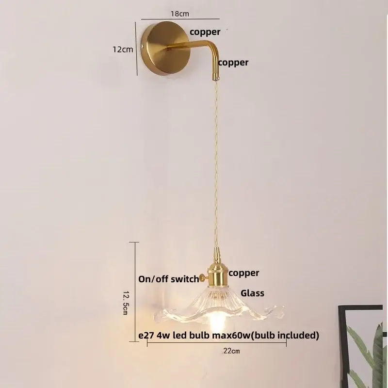 Floral glass copper led wall sconce with brass finish curved arm clear glass shade and integrated on off switch