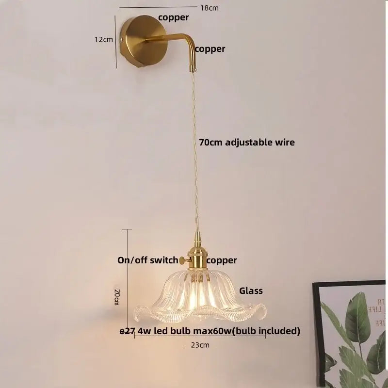 A delicate brass-finished floral glass copper led wall sconce with fluted glass shade and adjustable copper led wall wire