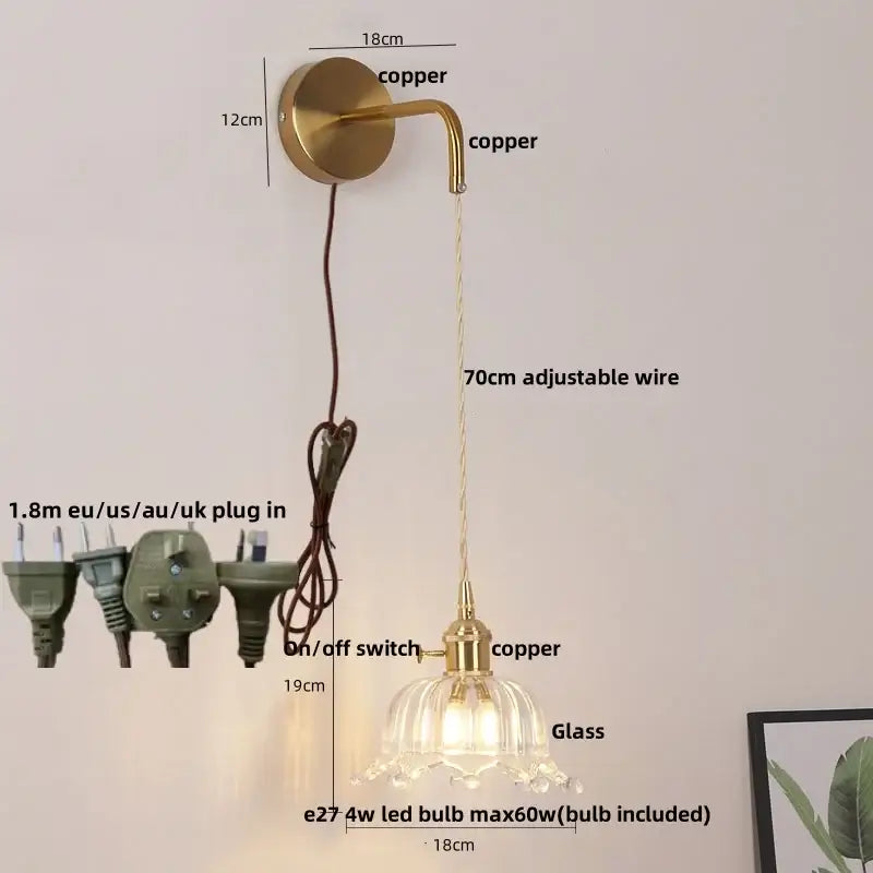 Gold-toned copper led wall sconce with a delicate floral glass lampshade and adjustable wire for bathroom lighting